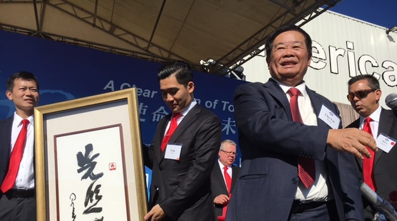 Cho Tak Wong, chairman of Fuyao Global — seen here to the right of a Chinese gift at the Moraine plant’s Oct. 7 grand opening — estimated earlier this month that the Fuyao Glass America plant in Moraine could have 3,000 employees at some point, but he attached no timeline to that prediction. The plant is headed toward 2,500 employees today. THOMAS GNAU/STAFF