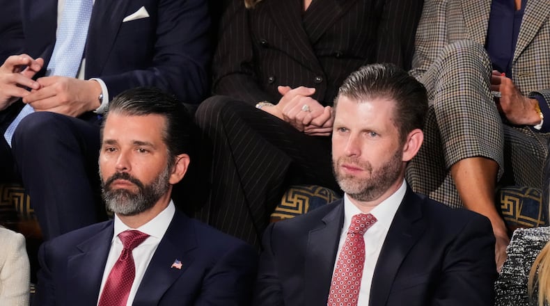 Donald Trump Jr. and Eric Trump listen to President Donald Trump's State of the Union address to a joint session of Congress in the House chamber at the U.S. Capitol in Washington, Tuesday, Feb. 24, 2026. (AP Photo/Alex Brandon)