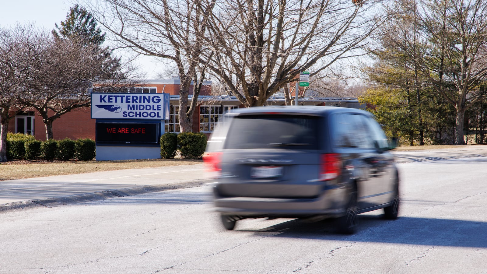 A van drives on Glengarry Drive near Kettering Middle School on Tuesday, Jan. 20. Last fall, three students were hit in crosswalks in Kettering in a five-week span. BRYANT BILLING/STAFF