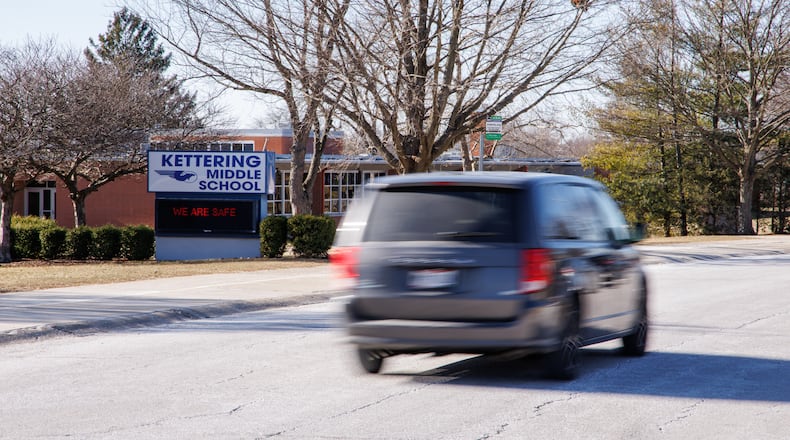 A van drives on Glengarry Drive near Kettering Middle School on Tuesday, Jan. 20. BRYANT BILLING/STAFF