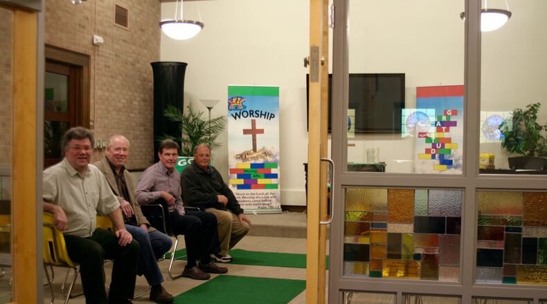 Building committee chairman David Helmers (from left), architect Jim Mitchell, board chairman Scott Bergren and Christ United Methodist Church building manager Mark Fellows show off a new children’s classroom at the Kettering church. PAMELA DILLON/CONTRIBUTED
