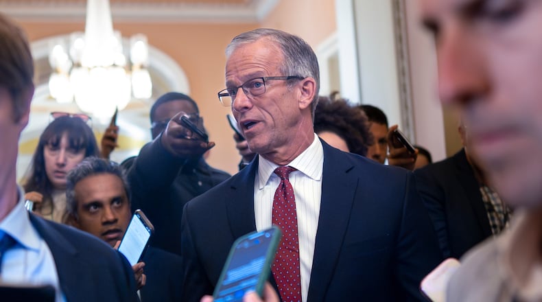 Senate Majority Leader John Thune, R-S.D., pauses in his office doorway to speak to reporters on day 20 of the government shutdown, at the Capitol in Washington, Monday, Oct. 20, 2025. (AP Photo/J. Scott Applewhite)