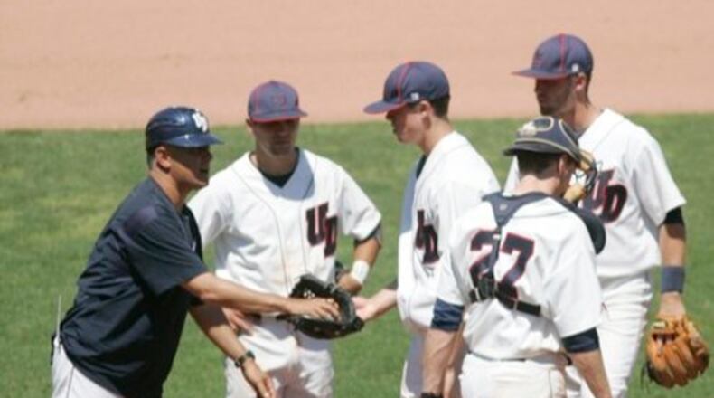 Tony Vittorio (left), the UD baseball coach, takes the ball from starting pitcher, Cameron Hobson, with two outs in the seventh inning.The University of Dayton baseball team played UMass, at Fifth Third Field, in Dayton. It was a second round Atlantic 10 conference tournament game. Dayton won the game 9 to 5. Hobson gave up 4 runs, on 5 hits and he hit 6 batters, yet still picking up the victory.