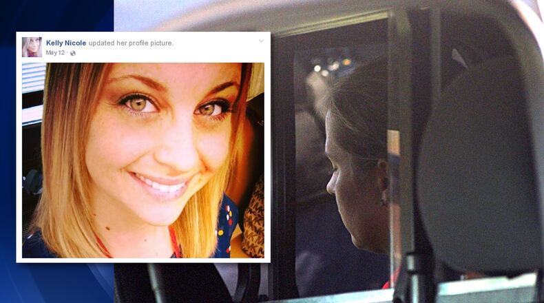 Facebook Photo of Kelly Stone and woman arrested in back of Kettering cruiser. STAFF PHOTO/Marshall Gorby