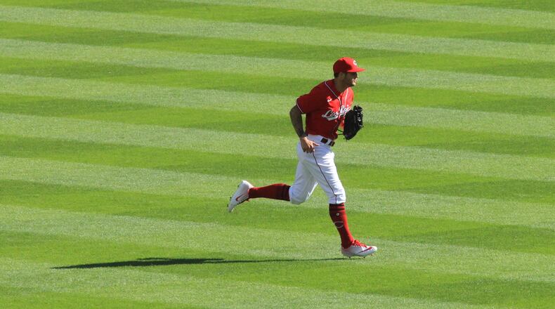 Reds center fielder Nick Senzel returns to the dugout after an inning during a game against the White Sox on Sunday, Sept. 20, 2020, at Great American Ball Park in Cincinnati. David Jablonski/Staff