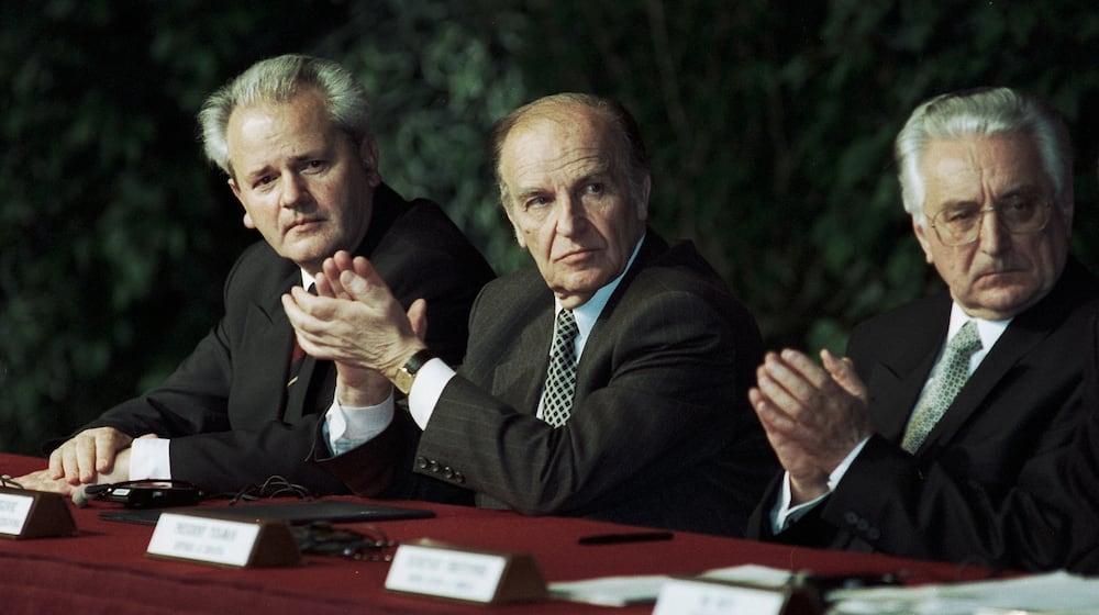 With most of the press corps gone, I made my way to a shaky platform on the far right side of the stage to get a better angle. A videographer for one the national television networks cursed at me for the vibration I created when I stepped on the platform. From my new vantage point and with a telephoto lens, I was able to capture a photo of the three presidents isolated from the throng, with Serbian President Slobodan Milosevic (left) lost in thought, looking toward my lens and the other two, Bosnian and Herzegovinia President Alijan Izetbegovic (center) and Croatian President Franjo Tudjman applauding the remarks of one of the speakers. That photo later ran across two pages in Time Magazine to accompany their coverage of the Dayton Peace Accords. JAN UNDERWOOD / STAFF