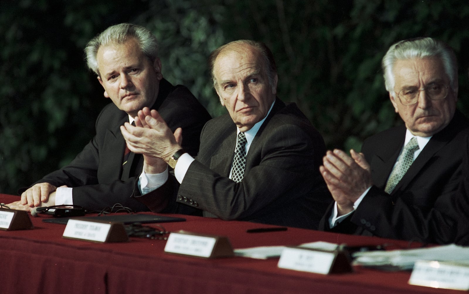 Retired Dayton Daily News staff photographer Jan Underwood: "Once the documents had all been initialed, the other photographers from our staff went back to the office to process and edit film. I volunteered to stay to photograph the rest of the ceremony. With most of the press corps gone, I made my way to a shaky platform on the far right side of the stage to get a better angle. A videographer for one the national television networks cursed at me for the vibration I created when I stepped on the platform. From my new vantage point and with a telephoto lens, I was able to capture a photo of the three presidents isolated from the throng, with Serbian President Slobodan Milosevic (left) lost in thought, looking toward my lens and the other two, Bosnian and Herzegovinia President Alijan Izetbegovic (center) and Croatian President Franjo Tudjman applauding the remarks of one of the speakers. That photo later ran across two pages in Time Magazine to accompany their coverage of the Dayton Peace Accords." JAN UNDERWOOD / STAFF