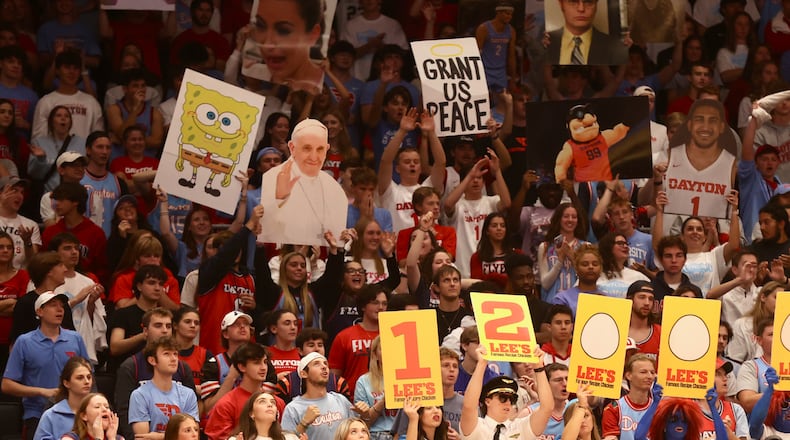 Dayton fans in the Red Scare student section cheer during an exhibition game against Xavier on Sunday, Oct. 20, 2024, at UD Arena. David Jablonski/Staff