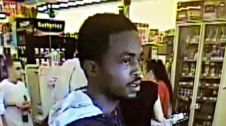 This photo of the man suspected in the Family Dollar armed robbery in Dayton on Monday afternoon, July 4, 2016, was taken from surveillance video, Dayton police said. (Jim Noelker/Staff)
