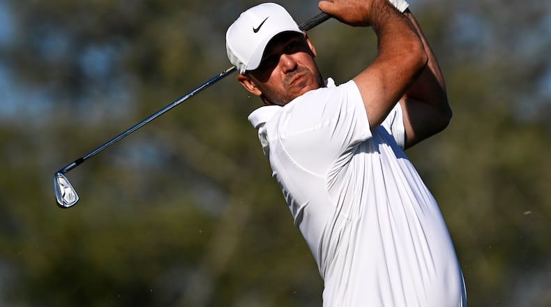 Brooks Koepka tees off on the eighth hole while playing the North Course at Torrey Pines during the second round of the Farmers Insurance Open golf tournament Friday, Jan. 30, 2026, in San Diego. (AP Photo/Denis Poroy)