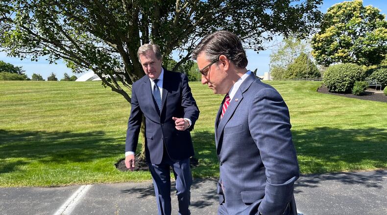 House Speaker Mike Johnson, R-La. (right), and U.S. Rep. Mike Turner, R-Dayton, prepare to speak to the media Friday just outside Wright-Patterson Air Force Base at the Hope Hotel and Conference Center. THOMAS GNAU/STAFF