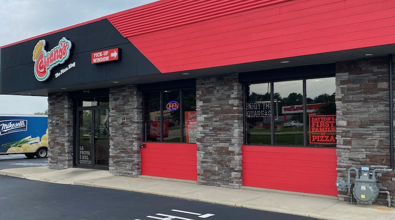 The new location at 6315 Brandt Pike in Huber Heights features a family table, history wall and pick-up window. SHARON WILMORE/STAFF