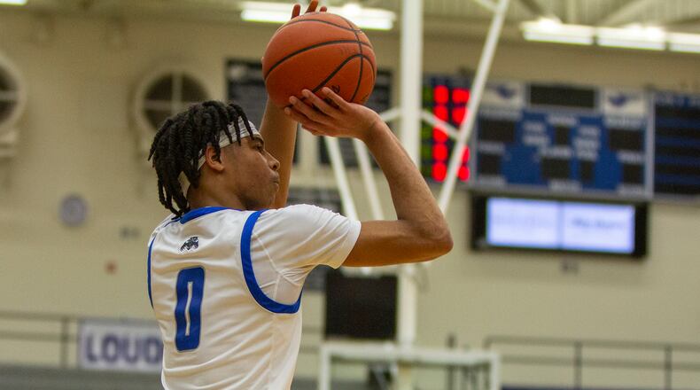 Dunbar sophomore B.J. Hatcher shoots for one of his five 3-pointers in Friday night's 77-32 tournament victory over Franklin. Hatcher scored 31 points. CONTRIBUTED/Jeff Gilbert