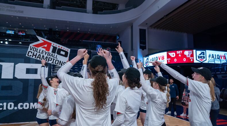 Dayton celebrates after winning the Atlantic 10 Conference volleyball tournament championship on Sunday, Nov. 21, 2021, at the UMPC Cooper Fieldhouse in Pittsburgh, Pa. Photo courtesy of Dayton Athletics