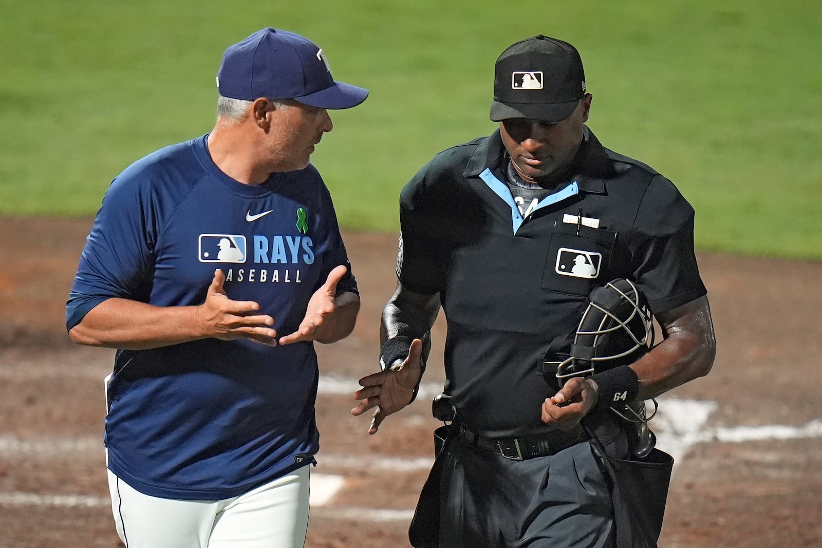 Tampa Bay Rays manager Kevin Cash argues with home plate umpire Alan Porter after Porter overruled another umpire on a strike out by Josh Lowe during the fifth inning of a baseball game against the Houston Astros Tuesday, May 20, 2025, in Tampa, Fla. (AP Photo/Chris O'Meara)