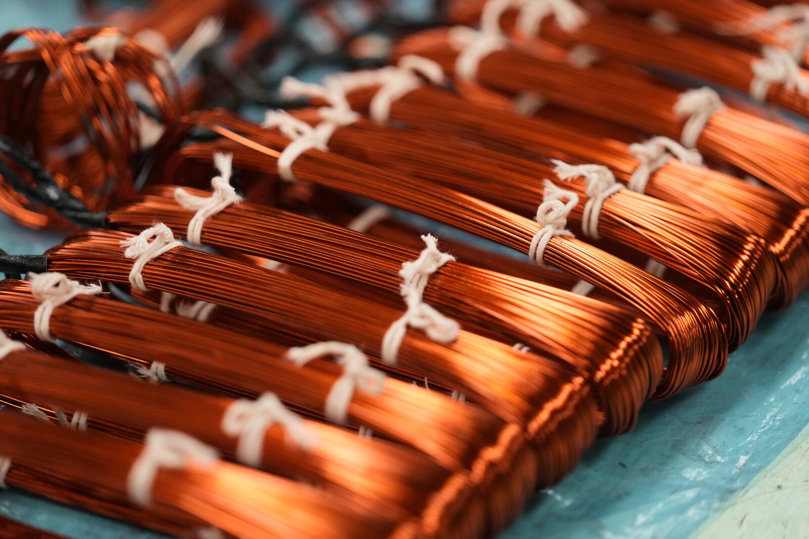 Bundles of copper cables lie at an electric engine plant in Mexico City, Wednesday, April 2, 2025. (AP Photo/Fernando Llano)