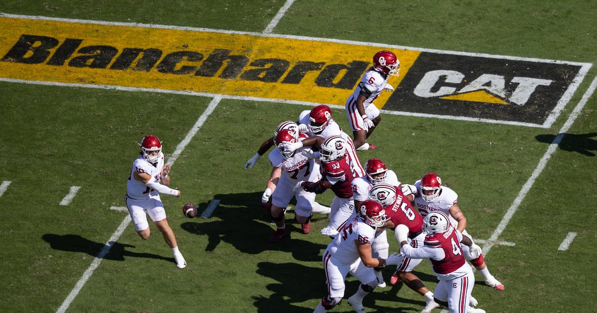 All about the logo: Schools adding corporate gridiron ads to level revenue-sharing...