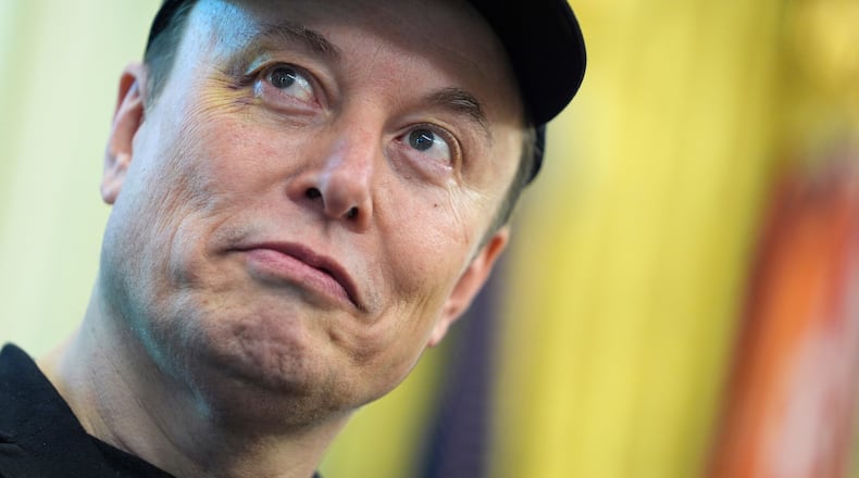 FILE - Elon Musk listens as President Donald Trump speaks during a news conference in the Oval Office of the White House, May 30, 2025, in Washington. (AP Photo/Evan Vucci, File)