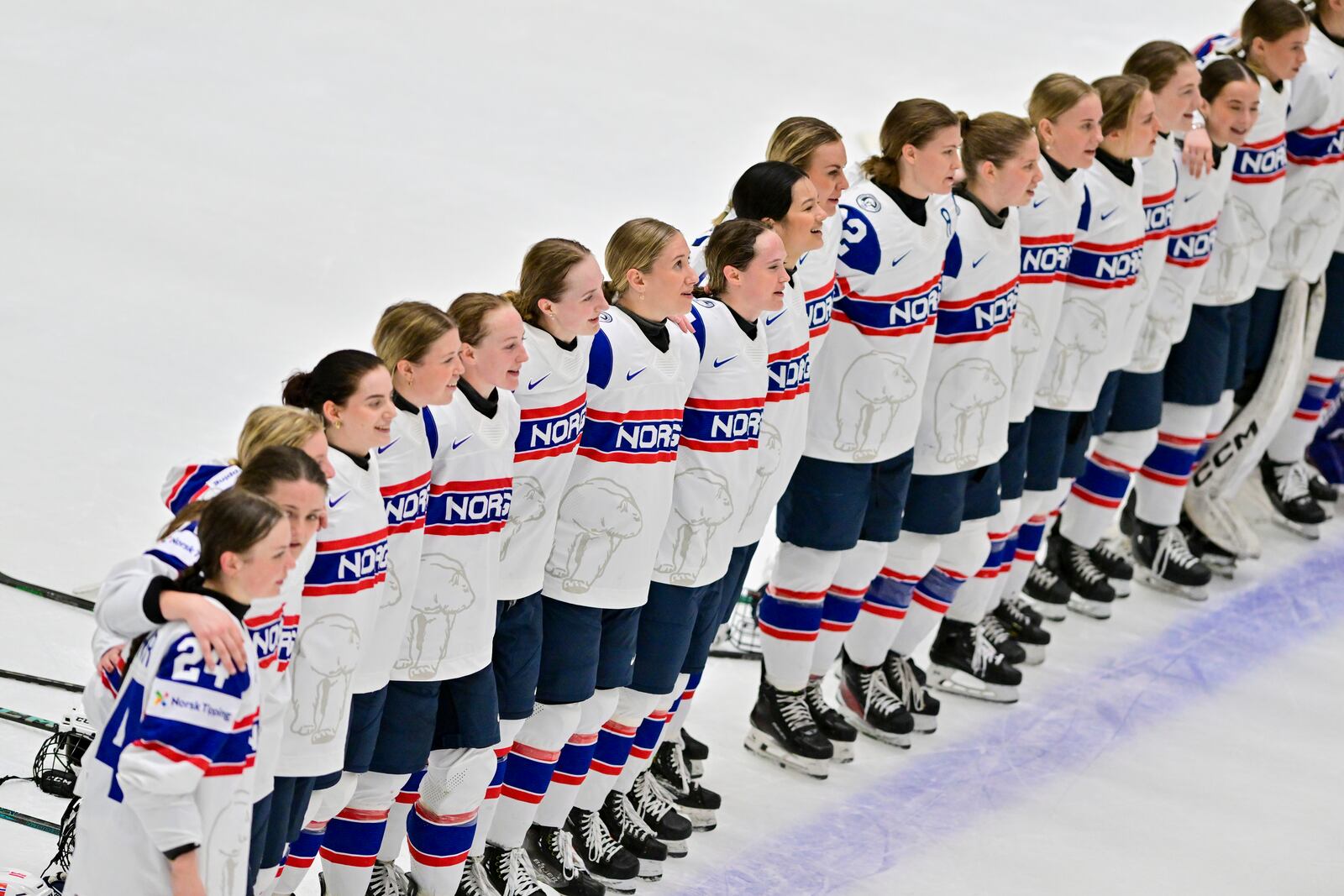 Norway's players line up during the national anthem for the winners during the IIHF Women's World Championship, Group B, match between Hungary and Norway, in Ceske Budejovice, Czech Republic, Sunday, April 13, 2025. (Václav Pancer/CTK via AP)