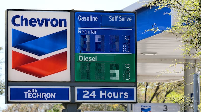 Prices are displayed on a Chevron gas station sign in Houston, Tuesday, March 17, 2026. (AP Photo/Ashley Landis)