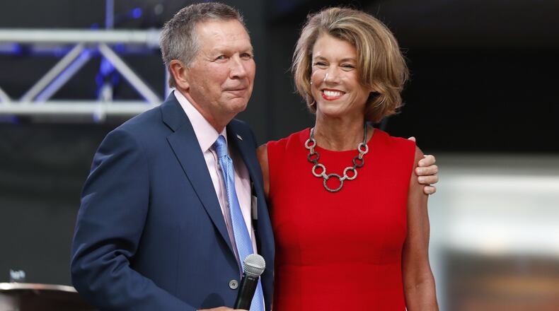 Ohio Gov. John Kasich, left, arrives with his wife Karen at the The Rock and Roll Hall of Fame and Museum on Tuesday, July 19, 2016, in Cleveland, during the second day of the Republican convention. (AP Photo/Alex Brandon)