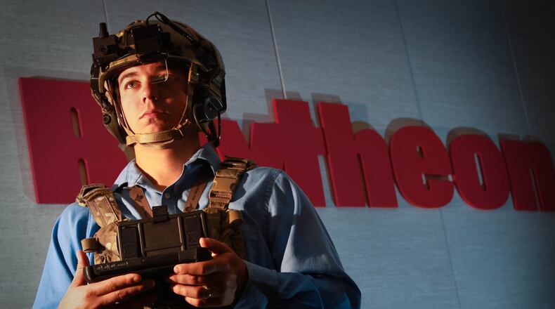 FILE: Systems Engineer Chris Nord is outfitted in a wearable situational awareness ensemble at Raytheon. The Air Force Research Laboratory and the Department of Defense are driving demand for wearable technology on the battlefield. Companies like Raytheon are trying to break into the market by taking technology developed in the cockpit and outfitting ground soldiers with adapted versions. JIM WITMER / STAFF