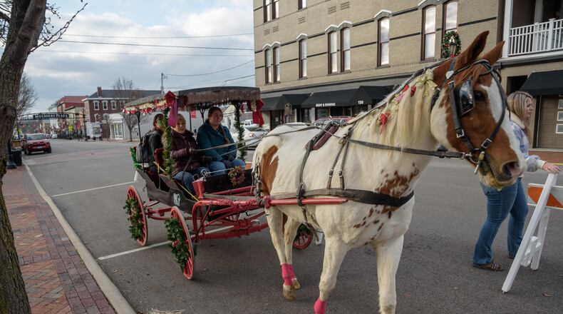 There’s no place like Home for the Holidays, the first of three free holiday events in Historic Downtown Lebanon kicked off on Saturday, December 5, 2020. Hosted by the Lebanon Chamber of Commerce, these scaled down events were created to fill the void of the 32nd Annual Horse Drawn Carriage Parade & Festival, cancelled to help prevent the spread of COVID-19. Activities include social distancing photos with Santa, family horse drawn carriage rides, chances to meet miniature horses, holiday shopping and dining. The events continue on Saturday, December 12th and 19th. Did we spot you there? TOM GILLIAM/CONTRIBUTING PHOTOGRAPHER