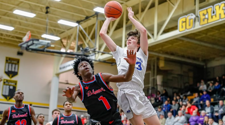 Cutline: Miamisburg High School's Colin Murphy shoots over a Belmont defender during their Division I sectional game at Centerville High School on Friday night. Michael Cooper/CONTRIBUTED PHOTO