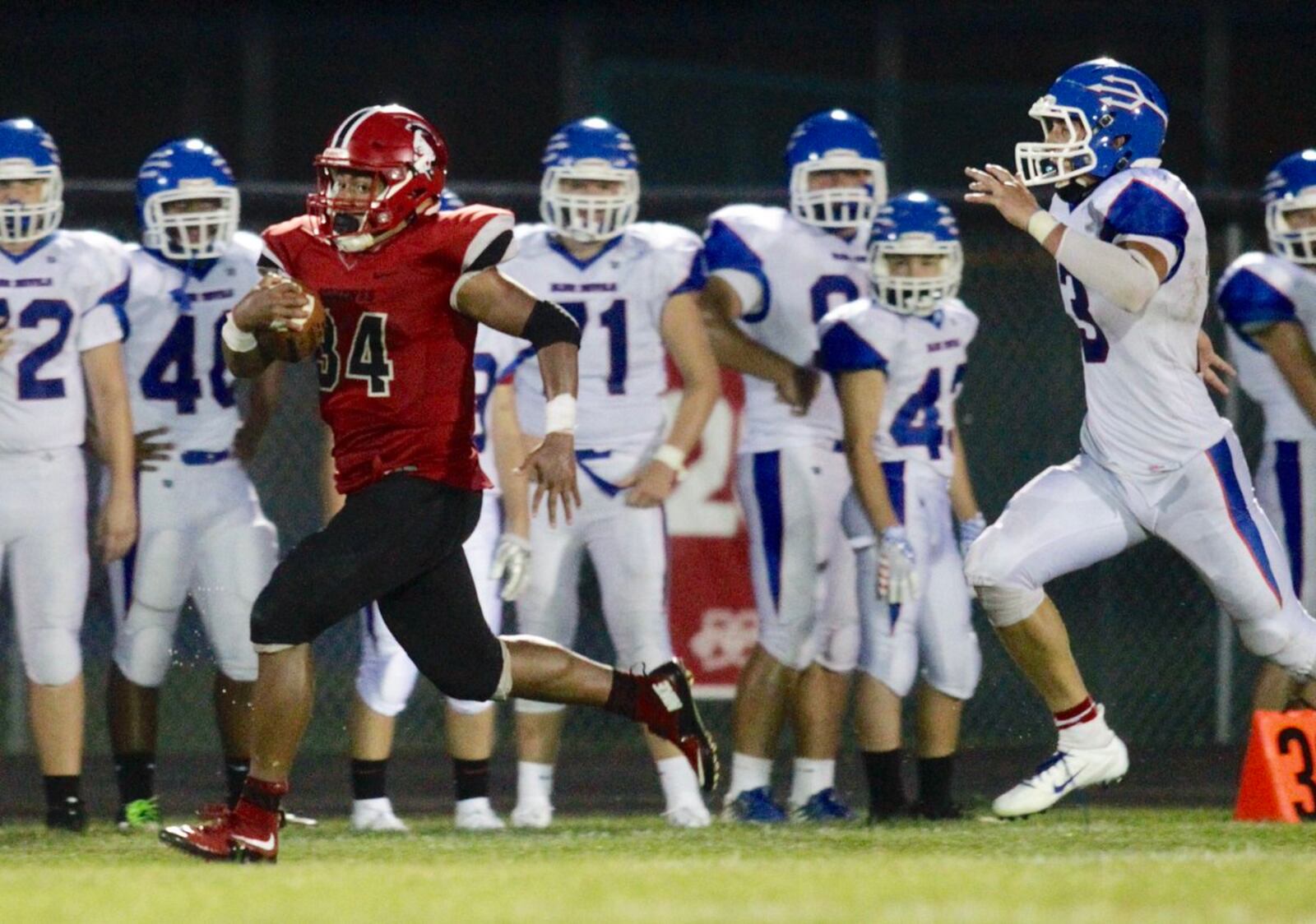 Madison’s Evan Crim sprints away from the Reading defense in a 46-0 victory Aug. 31 at Brandenburg Field in Madison Township. NICK GRAHAM/STAFF