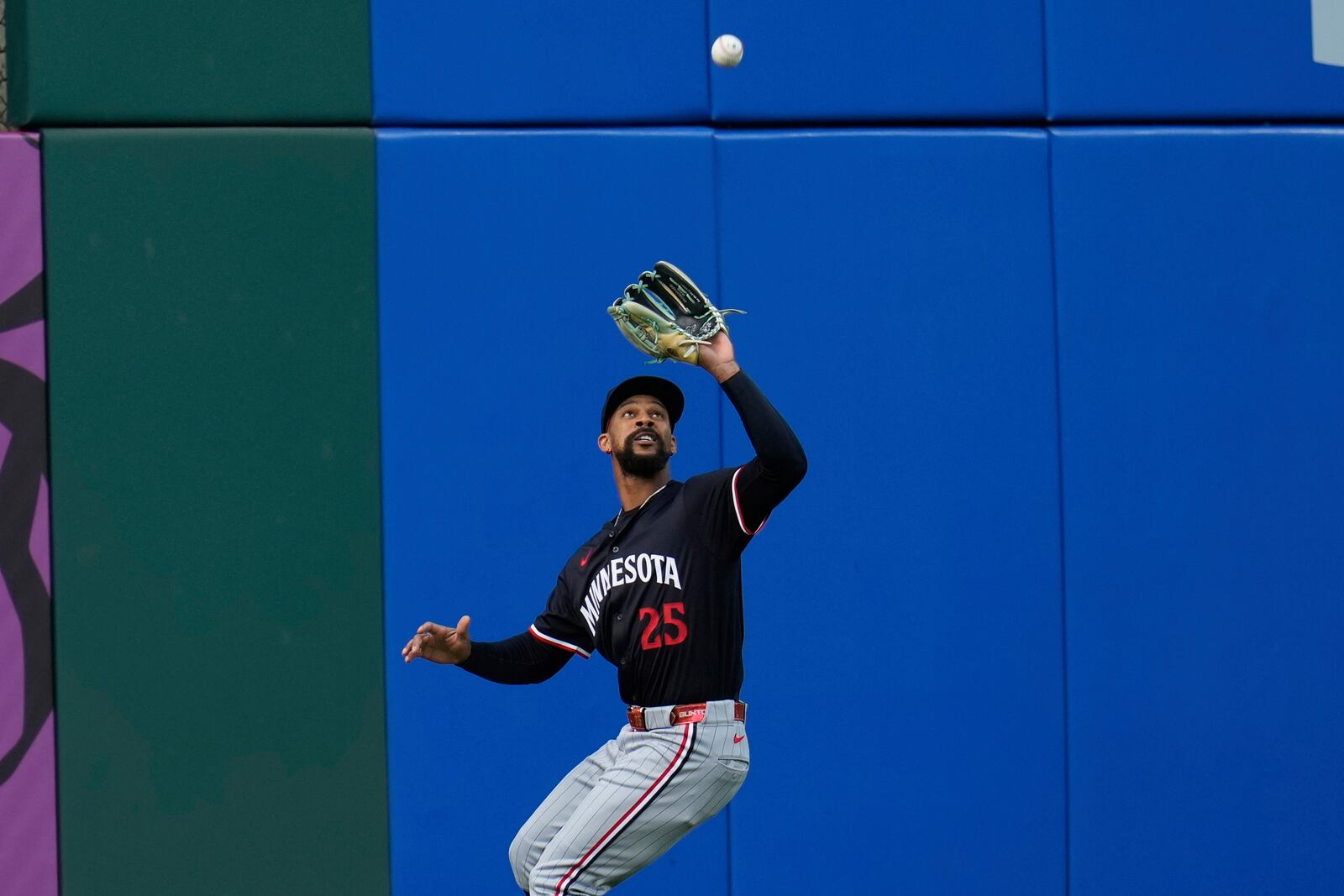Minnesota Twins center fielder Byron Buxton (25) catches a fly ball hit for an out by Cleveland Guardians' Daniel Schneemann in the second inning of a baseball game in Cleveland, Wednesday, April 30, 2025. (AP Photo/Sue Ogrocki)