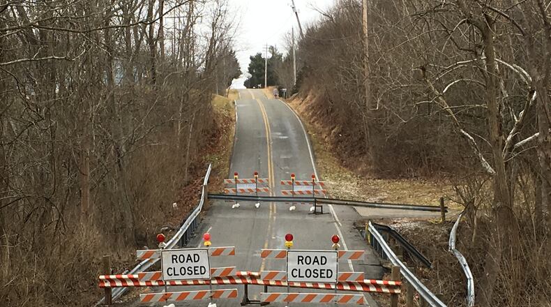 The Shawhan Road bridge, closed since a crash involving a hill-hopping teen on Jan. 5, has reopened. LAWRENCE BUDD/STAFF
