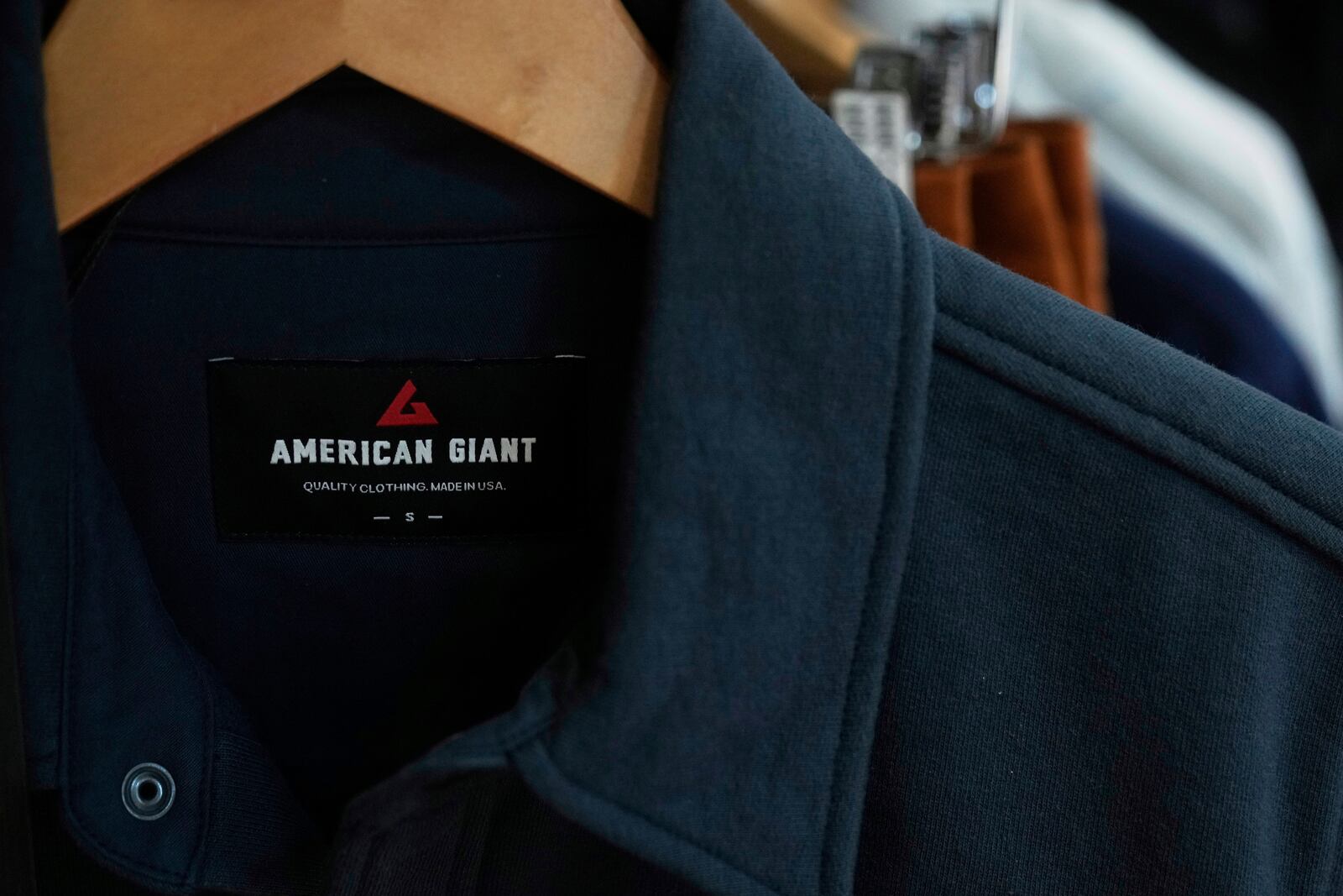 An American Giant logo is shown on clothing at the company's showroom in San Francisco, Thursday, April 17, 2025. (AP Photo/Jeff Chiu)