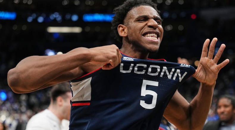 UConn forward Tarris Reed Jr. (5) reacts after the team's win against Duke in the Elite Eight of the NCAA college basketball tournament, Sunday, March 29, 2026, in Washington. (AP Photo/Abbie Parr)