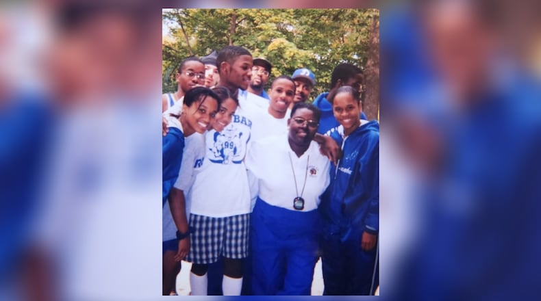 Dunbar High School multisport coach Anna Earley poses for a photo with a group of her athletes. CONTRIBUTED PHOTO