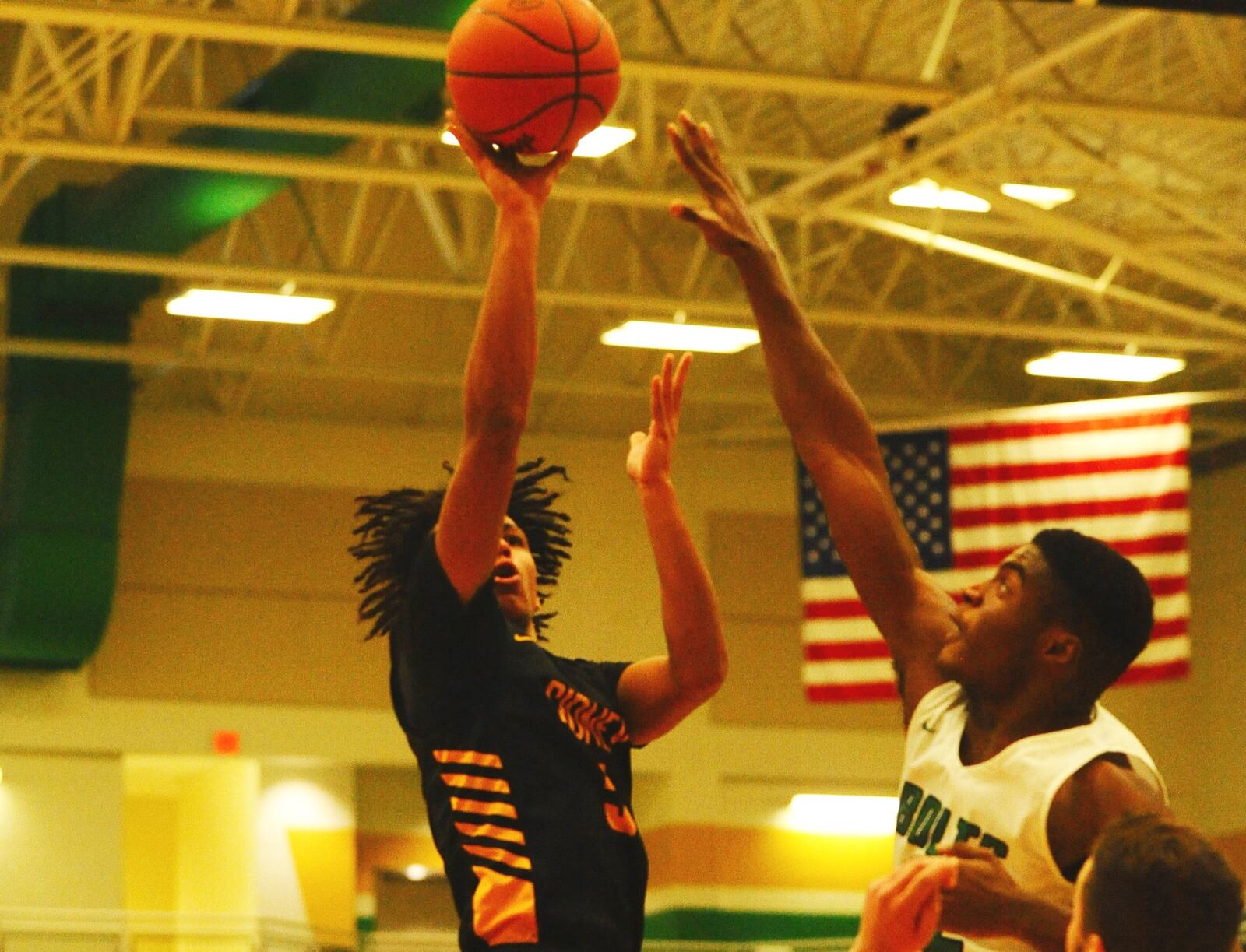 Sidney’s Darren Taborn gets a shot off over Northmont’s Ifeanyi Nwanoro. Sidney defeated host Northmont 72-68 in a boys high school basketball game on Tuesday, Jan. 15, 2019. GREG BILLING / CONTRIBUTED