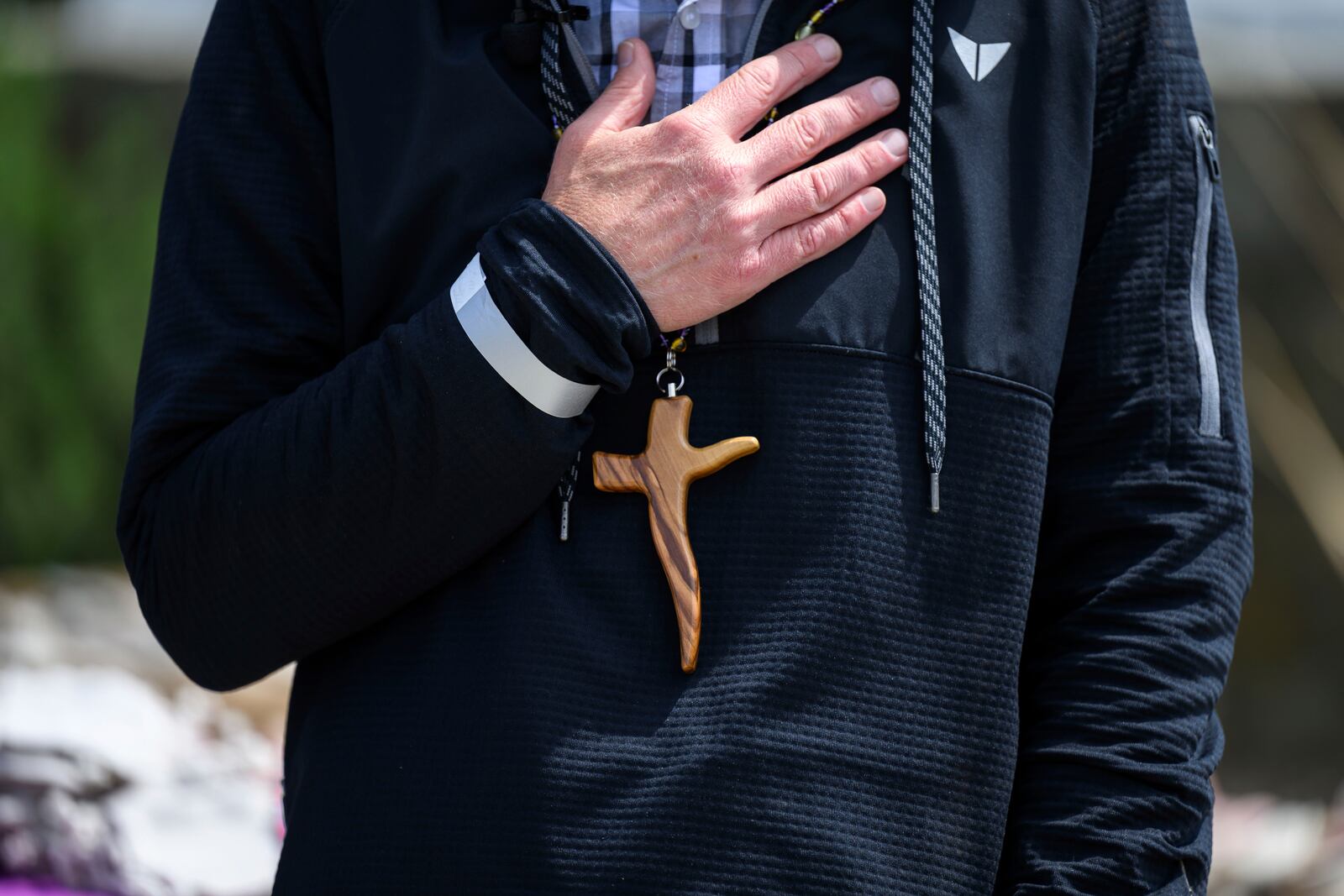 A cross necklace is seen on Pastor John Shaver during a Cross Walk event by the Community United Methodist Church of the Pacific Palisades, Friday, April 18, 2025, in the Pacific Palisades area of Los Angeles. (AP Photo/William Liang)