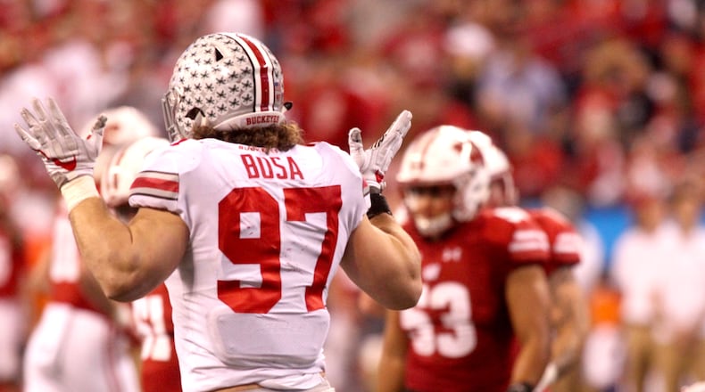 Ohio State's Nick Bosa celebrates after a tackle against Wisconsin on Dec. 2, 2017, at Lucas Oil Stadium in Indianapolis. David Jablonski/Staff