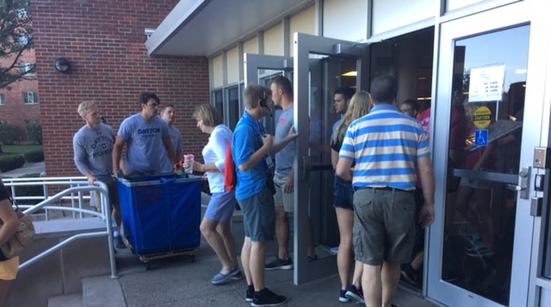 Students in the University of Dayton’s largest and most diverse freshman class in the school’s history began moving into their dorms Friday. The class numbers around 2,250 students. MALIK PERKINS/STAFF