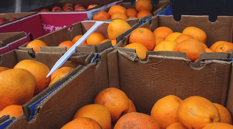A man selling fruit and other items at a roadside stand got a boost from a local graphics company.
