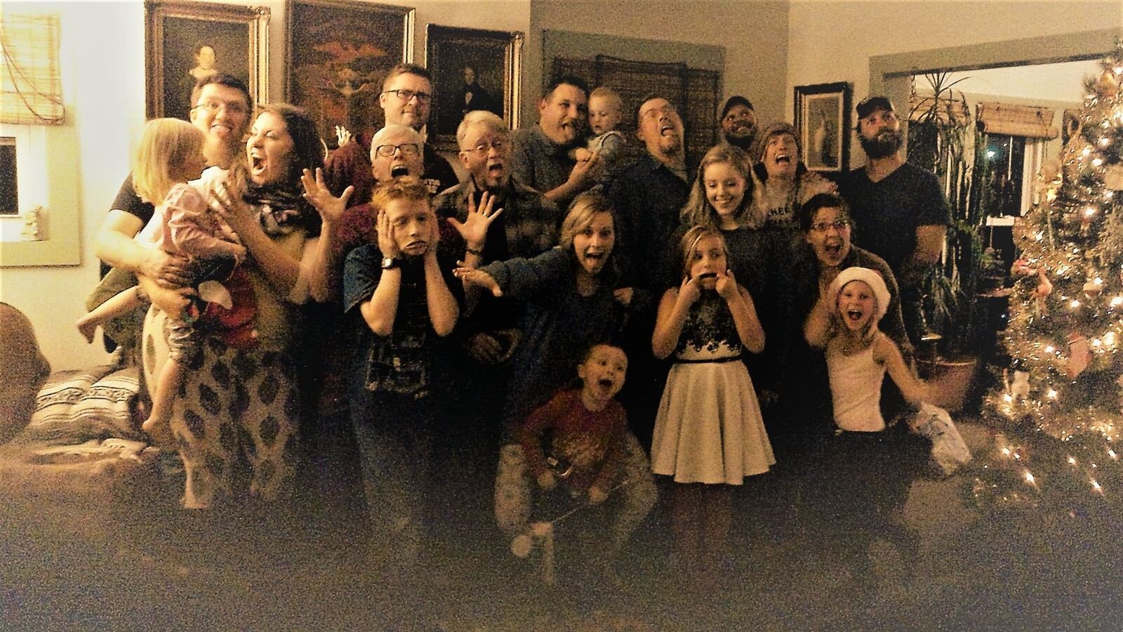 Robin and Chris Sassenberg (third and fourth in second row) with their family during the holidays. The couple's Hillsdale home was serious damaged during the Memorial Day tornadoes. The couple raised their blended family of six children in the house. Fletcher Austin, Robin's son (pictured behind her) died awaiting a liver transplant just days before the storm. His twin sister Abby Beach and other siblings with nieces, nephews and sisters and brothers in law.