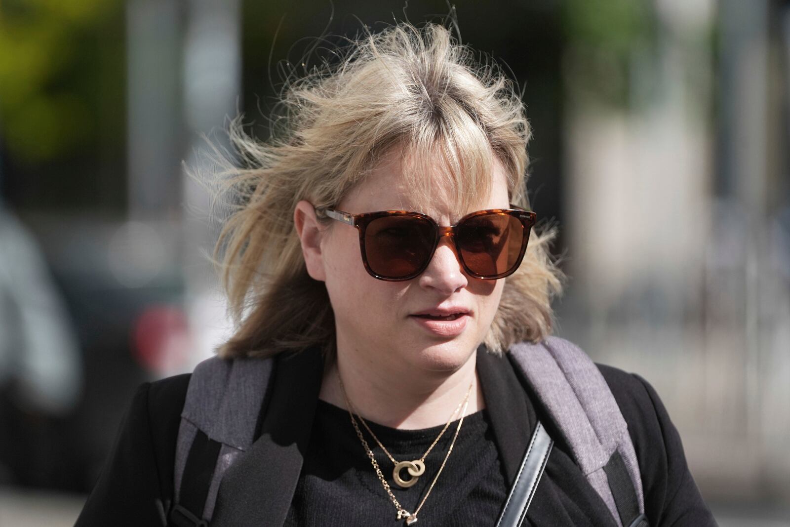 Producer Imelda Lynch walks outside the High Court where where former Sinn Fein president Gerry Adams is bringing a legal action against the BBC over allegations about the murder of an MI5 spy in 2006, in Dublin, Ireland, Wednesday May 28, 2025. (Brian Lawless/PA via AP)