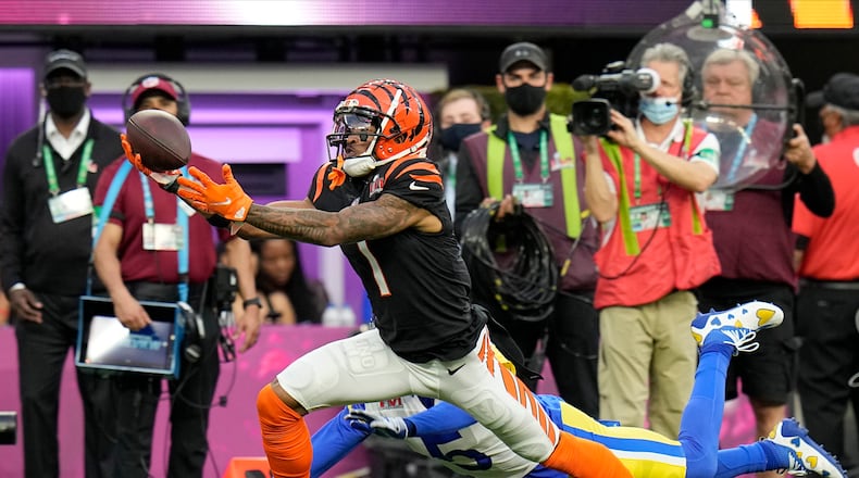 Cincinnati Bengals wide receiver Ja'Marr Chase (1) makes a catch against the Los Angeles Rams during the first half of the NFL Super Bowl 56 football game Sunday, Feb. 13, 2022, in Inglewood, Calif. (AP Photo/Chris O'Meara)