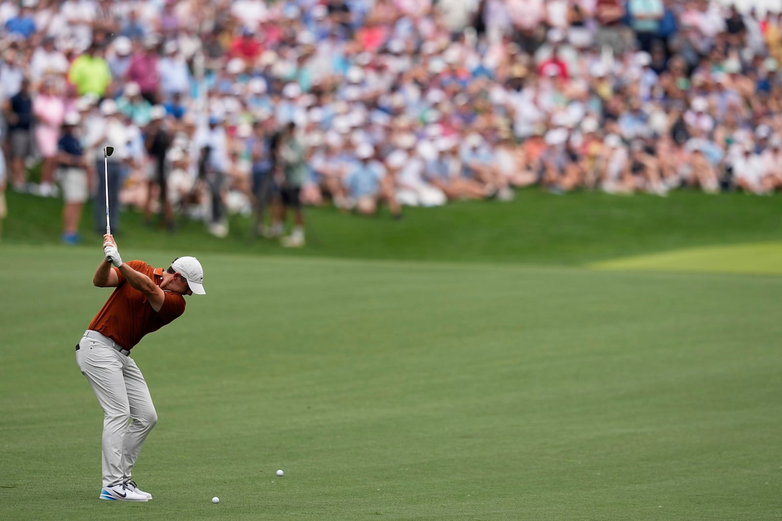 Rory McIlroy, of Northern Ireland, hits from the fairway on the second hole during the second round of the PGA Championship golf tournament at the Quail Hollow Club, Friday, May 16, 2025, in Charlotte, N.C. (AP Photo/David J. Phillip)