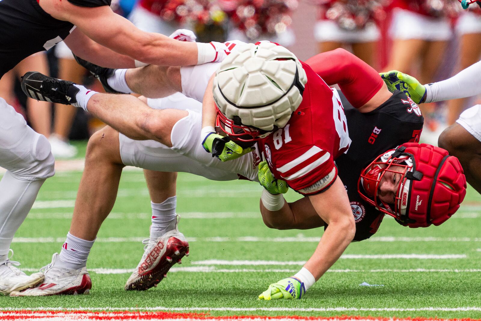 Nebraska linebacker Derek Wacker (42) tackles wide receiver Hayes Miller (81) during an NCAA college football practice Saturday, April 26, 2025, in Lincoln, Neb. (AP Photo/Dylan Widger)