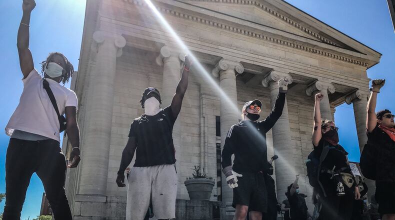 Protesters yell toward police from Courthouse Square on Sunday during a second day of protests in Dayton. Jim Noelker/Staff photo