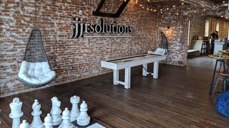Dayton-based business JJR Solutions recently was recently acquired by LMI, a provider of technology-enabled management consulting, logistics, and digital and analytics solutions to the U.S. government. Its offices at 607 E. 3rd St has exposed brick walls, original wood floors and a break room with games including oversized chess. CONTRIBUTED