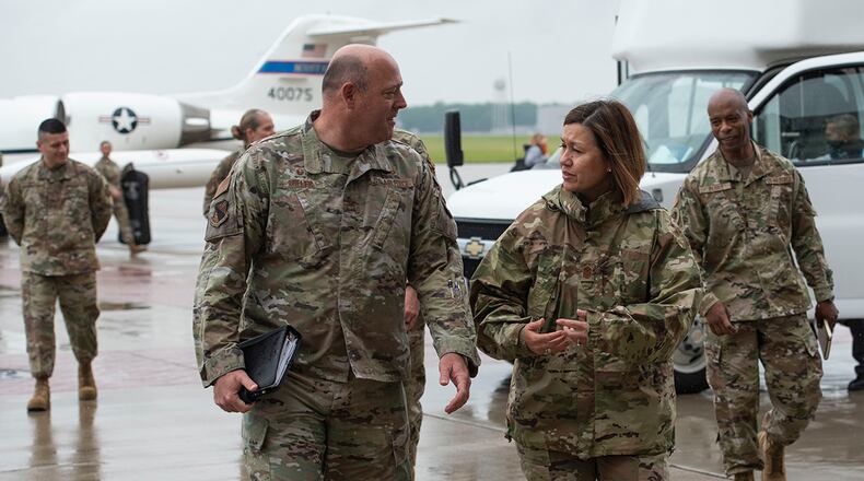 Chief Master Sergeant of the Air Force JoAnne S. Bass and Col. Patrick Miller, 88th Air Base Wing and installation commander, talk plane side after her arrival at Wright-Patterson Air Force Base June 2. Bass visited several offices around the installation. For full coverage of the chief master sergeant of the Air Force’s visit to WPAFB, check out next week’s issue of Skywrighter. U.S. AIR FORCE PHOTO/WESLEY FARNSWORTH
