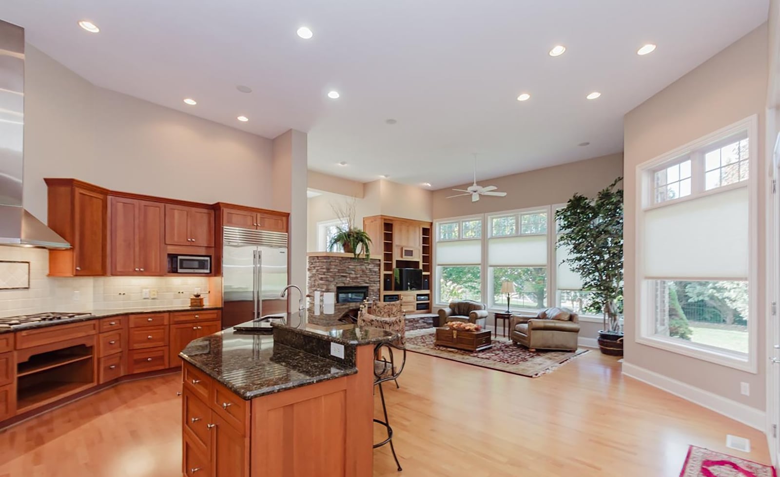 The kitchen and family rooms are open concept. The family room has a built in entertainment center and fireplace and an exterior door opening to the paver patio in the back yard. The kitchen has upscale appliances including a subzero refrigerator. CONTRIBUTED