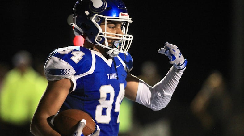 Miamisburg's Jackson McGohan celebrates a touchdown in the final seconds against Springfield on Friday, Oct. 15, 2021, at Holland Field in Miamisburg. David Jablonski/Staff