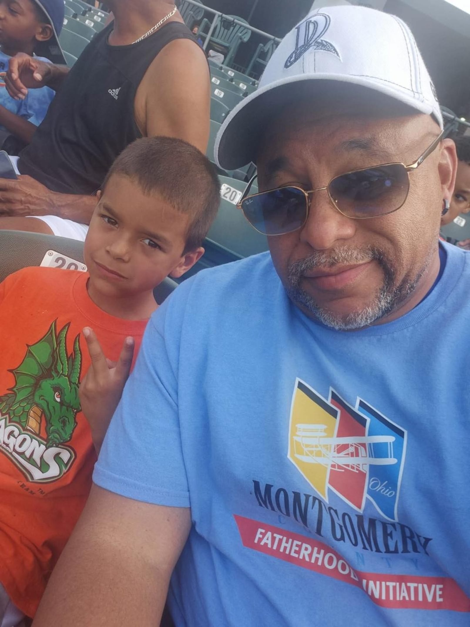 Michael Newsom with grandson PJ Foudray at Day Air Ballpark. CONTRIBUTED